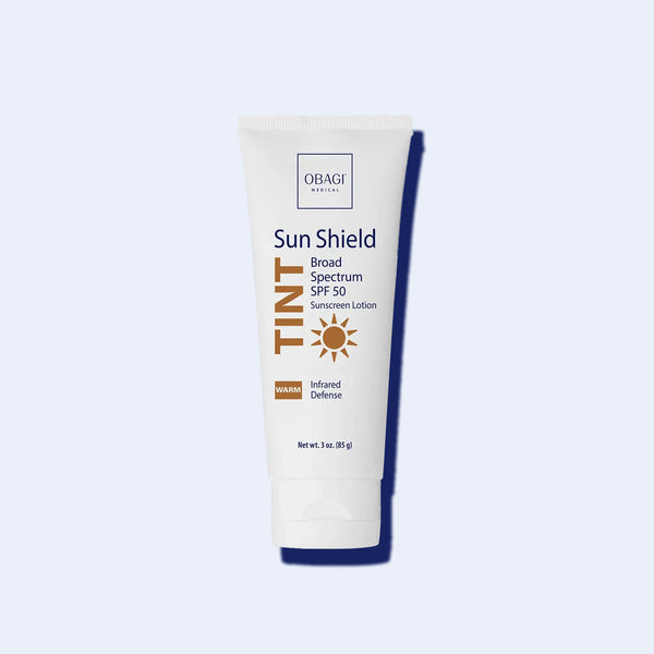 Obagi Sun Shield Tint Broad Spectrum SPF 50 Warm 85g sunscreen tube with dark blue cap on white background