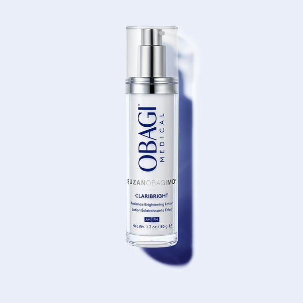 SUZANOBAGIMD Claribright Radiance Brightening Lotion 50g pump bottle with white lotion and silver dispenser on gray background